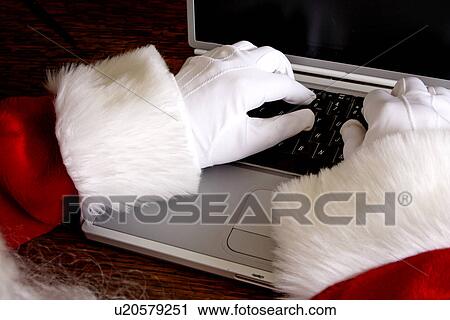 Santa with laptop View Large Photo Image Stock Image - Santa with laptop. Fotosearch