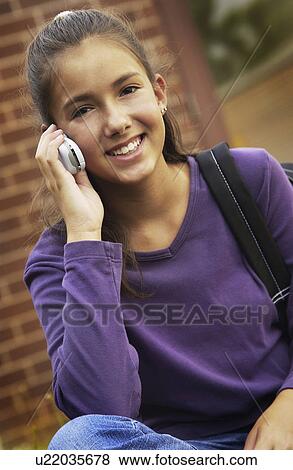 Stock Photo - Teen girl on cell phone. Fotosearch