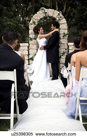 Stock Photography - Bride and Groom at altar. Fotosearch