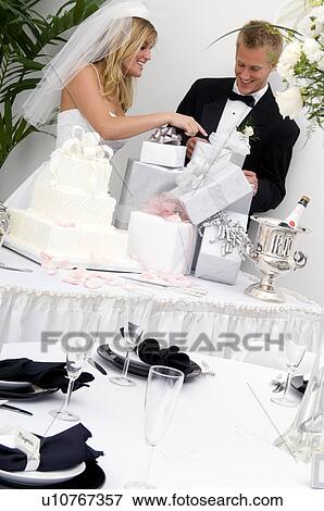 Stock Photo - Bride and groom at wedding reception. Fotosearch