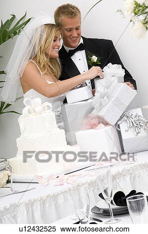 Bride and groom at wedding reception View Large Photo Image Stock Photography - Bride and groom at wedding reception. Fotosearch