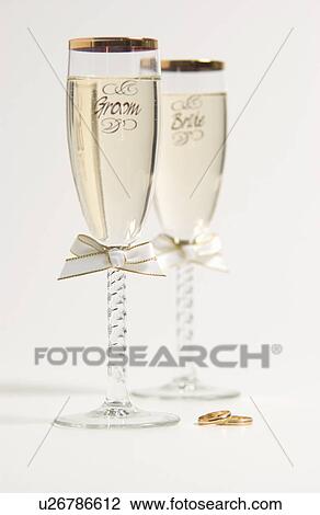 Stock Image - Bride and groom champagne glasses. Fotosearch