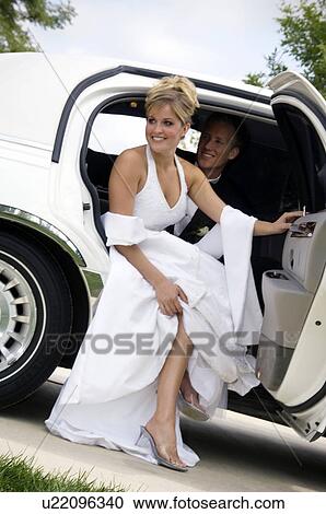 Bride and groom in limo View Large Photo Image Stock Image - Bride and groom in limo. Fotosearch