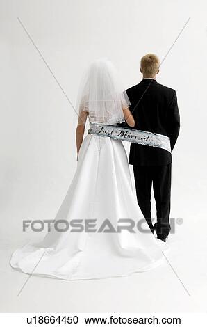 Bride and groom tied up with just married banner View Large Photo Image Stock Image - Bride and groom tied up with just married banner. Fotosearch