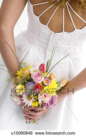 Bride holding bouquet View Large Photo Image Stock Photo - Bride holding bouquet. Fotosearch