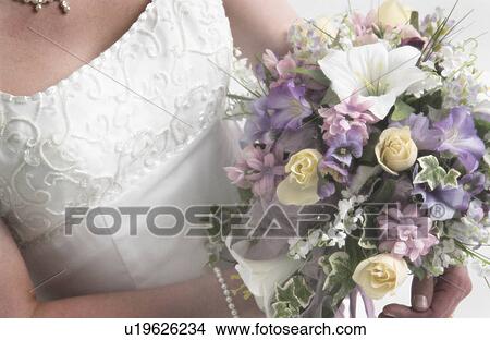 Bride with bouquet View Large Photo Image Picture - Bride with bouquet. Fotosearch