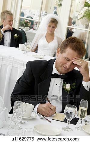Bride's father writing check View Large Photo Image Stock Photography - Bride's father writing check. Fotosearch
