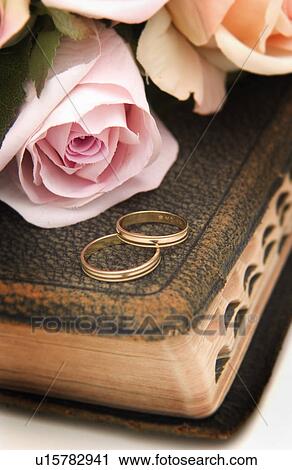 Wedding rings on Bible View Large Photo Image Stock Image - Wedding rings on Bible. Fotosearch