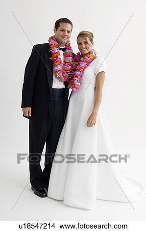 Bride and groom wearing Hawaiian leis View Large Photo Image Picture - Bride and groom wearing Hawaiian leis. Fotosearch