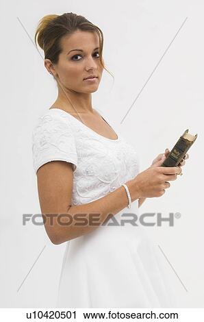 Bride holding Bible View Large Photo Image Stock Image - Bride holding Bible. Fotosearch