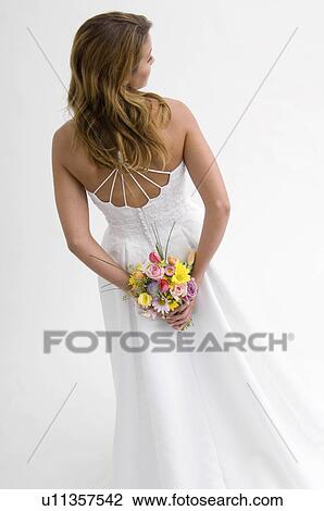 Stock Image - Bride holding bouquet. Fotosearch