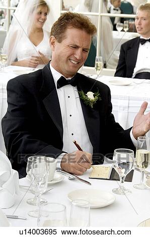 Stock Photography - Bride's father writing check. Fotosearch