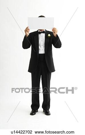 Stock Image - Groom holding blank sign. Fotosearch