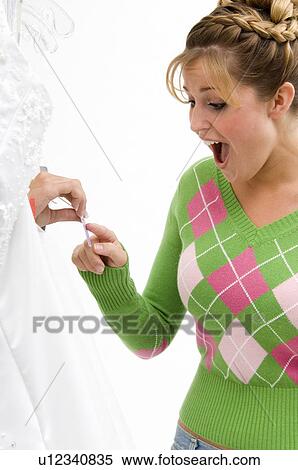 Woman choosing a bridal gown View Large Photo Image Stock Photography - Woman choosing a bridal gown. Fotosearch