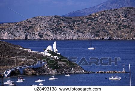 Boats in the water on island coast View Large Photo Image Stock Photo - Boats in the water on island coast. Fotosearch