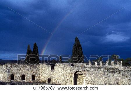Stock Photo - Rainbow over old stone building. Fotosearch