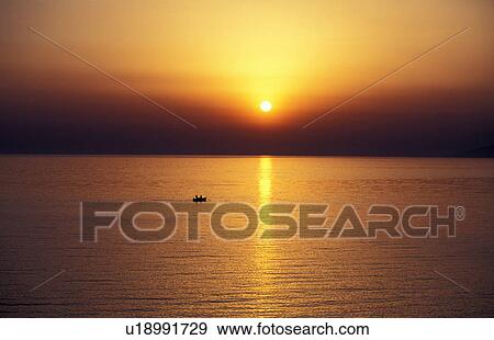 Row boat in the sea View Large Photo Image Stock Photo - Row boat in the sea. Fotosearch