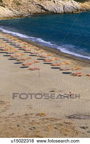 Stock Photo - Umbrellas on a beach. Fotosearch