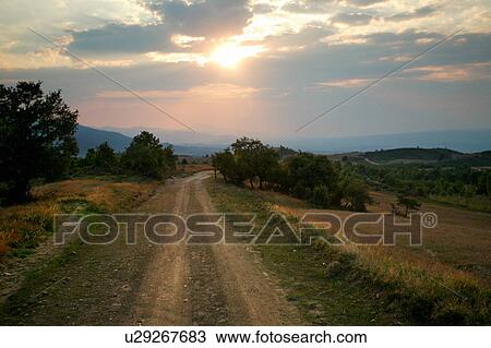 Stock Image - Country dirt road. Fotosearch