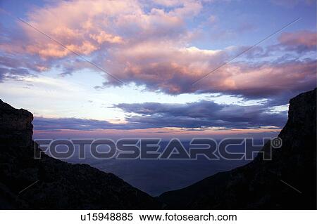 Mountain silhouette in sunset sky View Large Photo Image Stock Photography - Mountain silhouette in sunset sky. Fotosearch