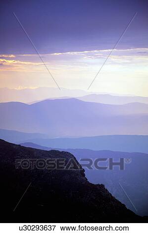 Stock Photo - Mountain silhouettes in the sky. Fotosearch
