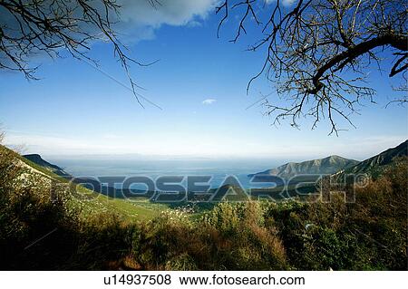 Stock Photo - View to the sea from the mountains. Fotosearch