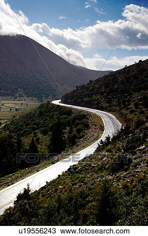 Stock Image - Winding road in countryside. Fotosearch