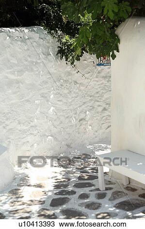 Stock Image - A whitewashed island alleyway. Fotosearch