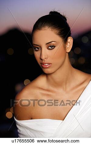 Closeup of young woman in evening wear View Large Photo Image Stock Photograph - Closeup of young woman in evening wear. Fotosearch