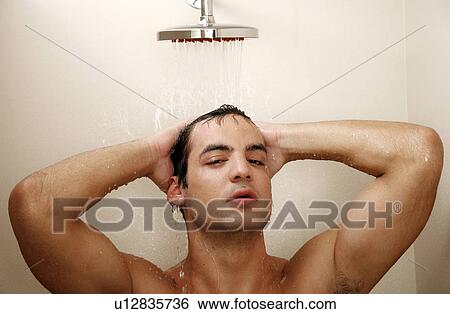 Stock Photograph - Man taking a shower at the gym. Fotosearch