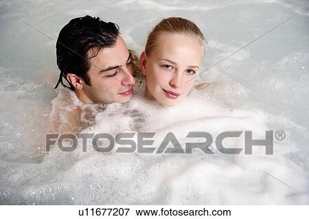 One man with one woman in jacuzzi at a spa View Large Photo Image Stock Photo - One man with one woman in jacuzzi at a spa. Fotosearch