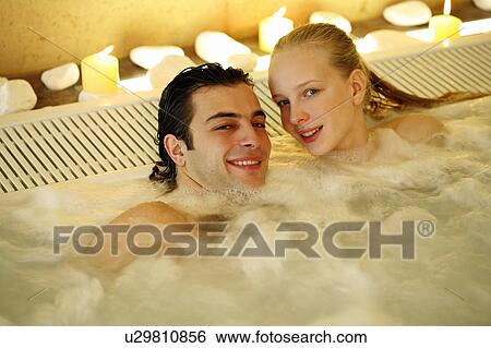 One man with one woman in jacuzzi at a spa View Large Photo Image Stock Photograph - One man with one woman in jacuzzi at a spa. Fotosearch