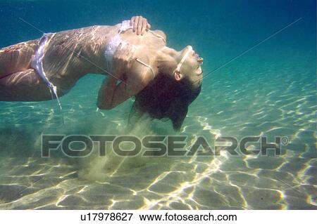 Woman under the water View Large Photo Image Stock Photo - Woman under the water. Fotosearch