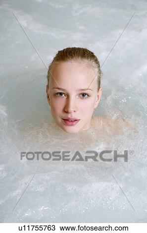 Young woman in jacuzzi at a spa View Large Photo Image Stock Image - Young woman in jacuzzi at a spa. Fotosearch