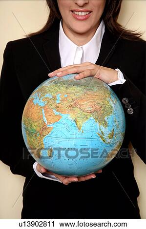 A woman holding a globe View Large Photo Image Stock Image - A woman holding a globe . Fotosearch
