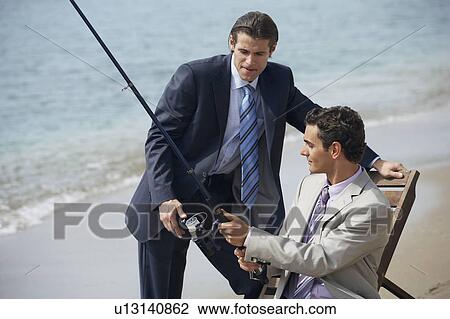 Businessmen on beach fishing View Large Photo Image Stock Image - Businessmen on beach fishing. Fotosearch