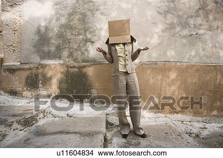 Businesswoman with head in a box View Large Photo Image Picture - Businesswoman with head in a box. Fotosearch