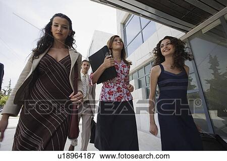 Stock Photo - Group of business people walking. Fotosearch