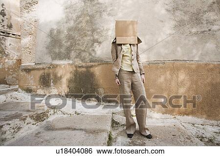 Stock Photograph - Businesswoman with head in a box. Fotosearch