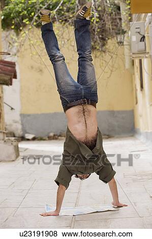 Stock Photo - Man doing handstand. Fotosearch