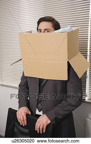 Office worker with head in a box View Large Photo Image Stock Image - Office worker with head in a box. Fotosearch