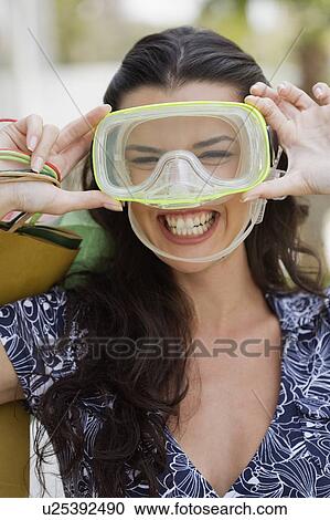 Stock Image - Woman wearing scuba mask. Fotosearch