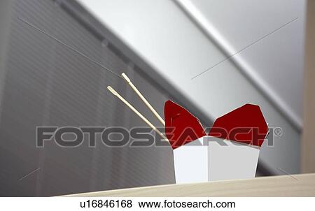 Stock Photo - Chinese food box on office desk. Fotosearch
