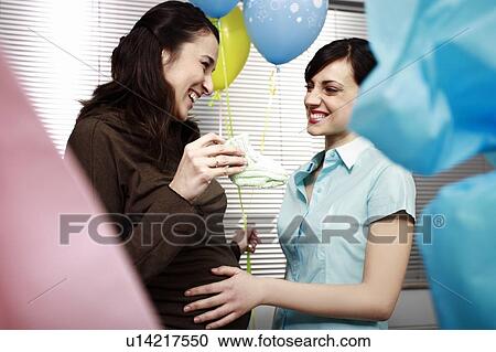 Pregnant office worker with colleague at party View Large Photo Image Stock Image - Pregnant office worker with colleague at party. Fotosearch