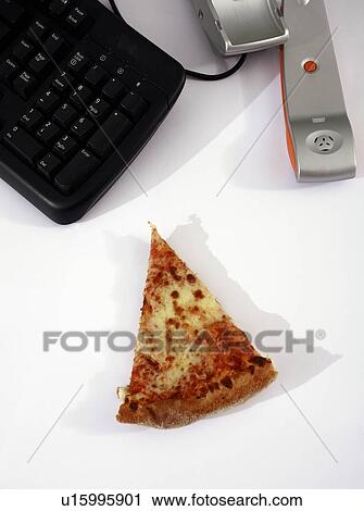 Slice of pizza next to phone on office desk View Large Photo Image Stock Image - Slice of pizza next to phone on office desk. Fotosearch