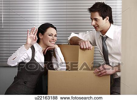 Stock Photo - Business people in office with boxes. Fotosearch