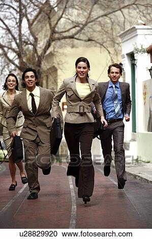 Stock Image - Business people running. Fotosearch