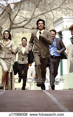 Business people running View Large Photo Image Stock Photo - Business people running. Fotosearch