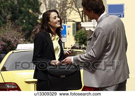 Businessman and woman meeting on street View Large Photo Image Stock Photo - Businessman and woman meeting on street. Fotosearch