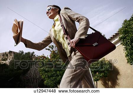 Stock Photo - Businesswoman on the go. Fotosearch